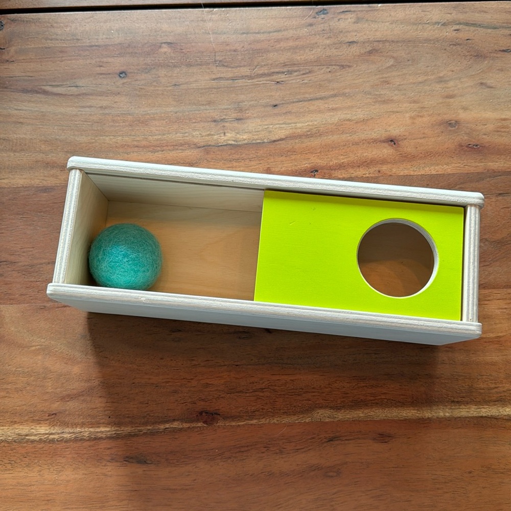 Lovevery sliding top box with felt ball